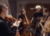 In focus: bass player and bassist playing together. Blurred in the foreground: Orchestra musicians:inside